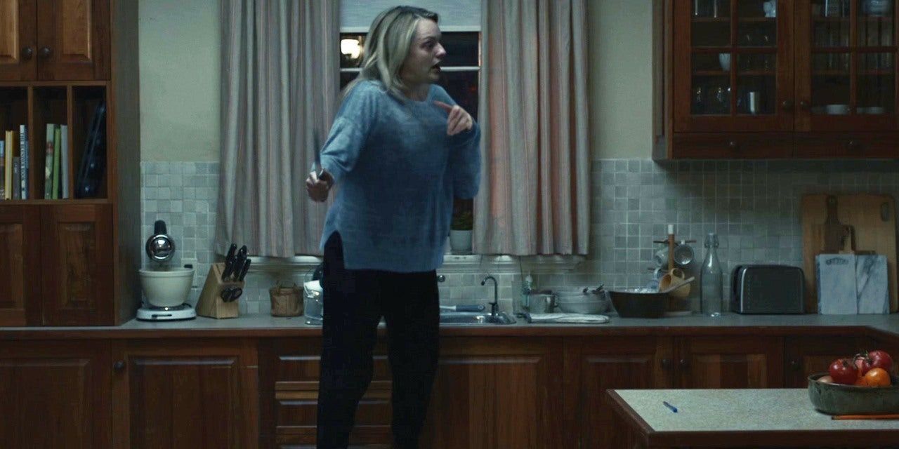 Elisabeth Moss floating in air holding knife being choked in The Invisible Man