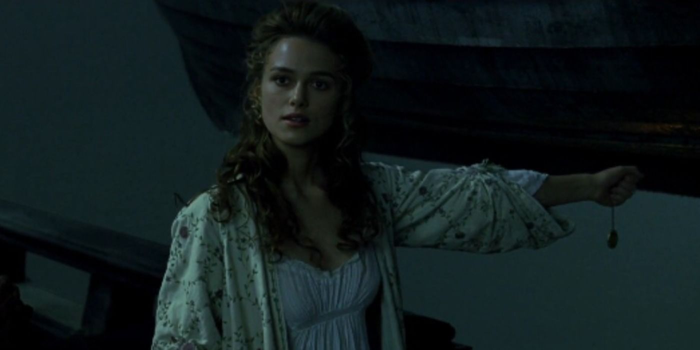 Elizabeth holding a necklace over the water in The Curse of the Black Pearl