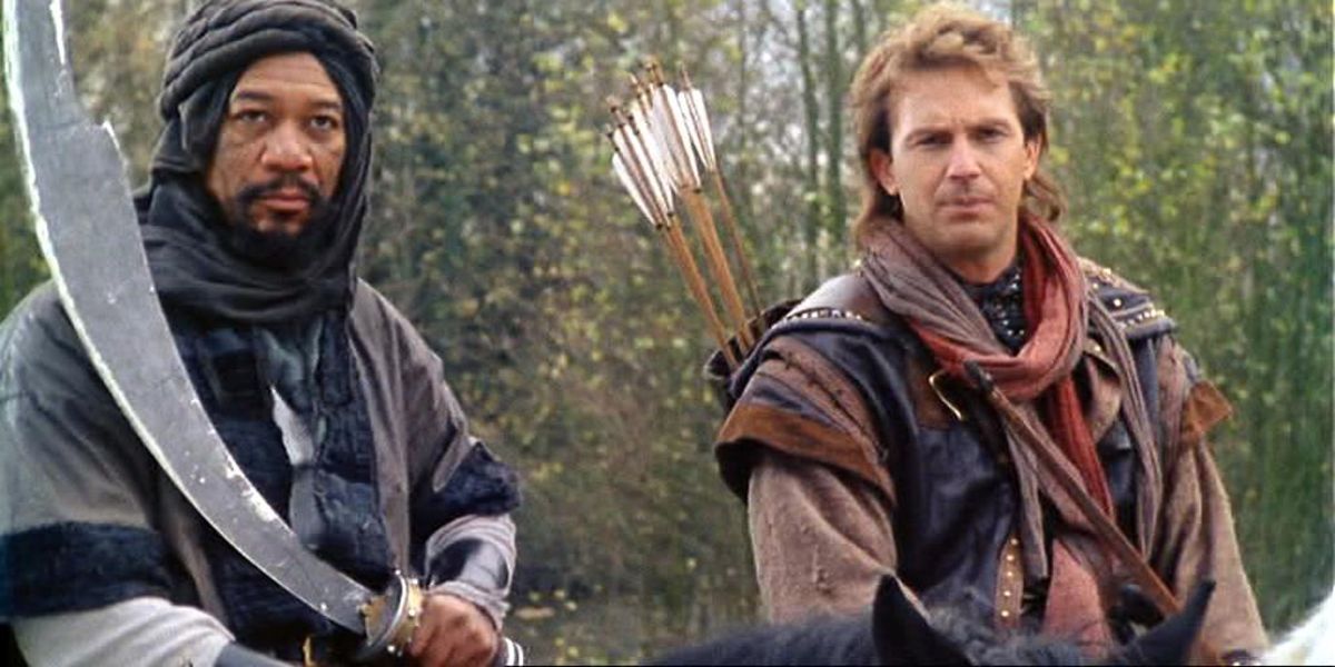 Azeem (Morgan Freeman) and Robin Hood (Kevin Costner) riding together through Sherwood forest in Robin Hood: Prince of Thieves