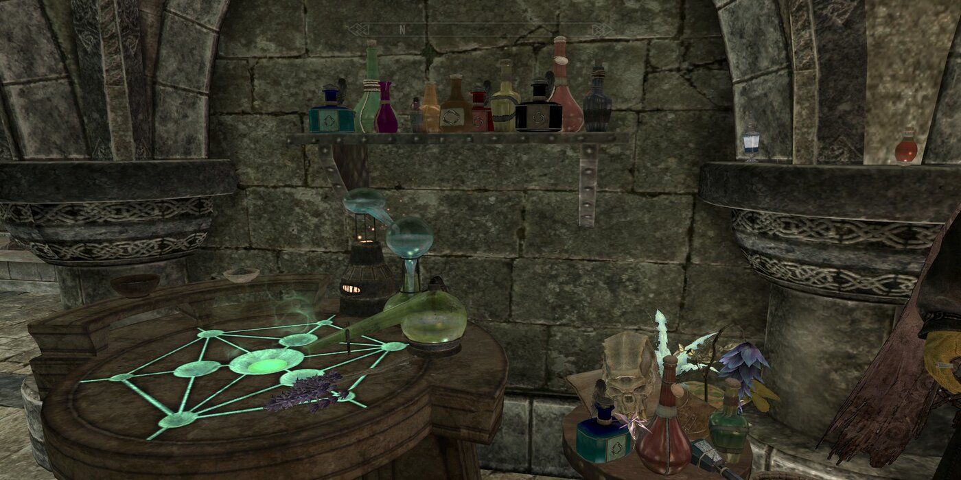 An image of one of Skyrim's Alchemy tables surrounded by bottles and plants