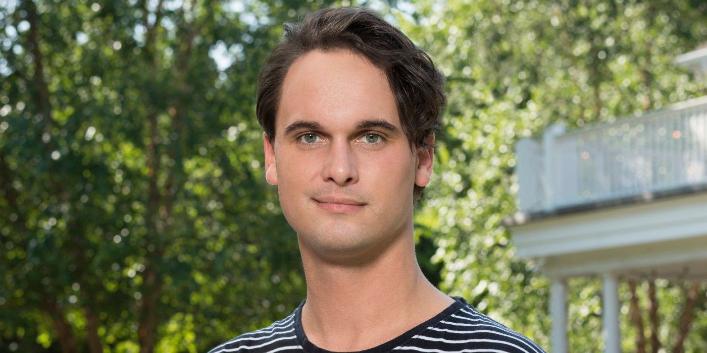 stephen mcgee posing outside summer house promo shot wearing striped shirt