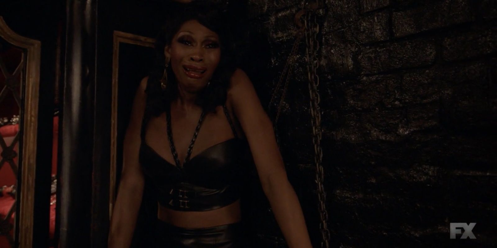 Elektra in a leather dress in Hellfire Club