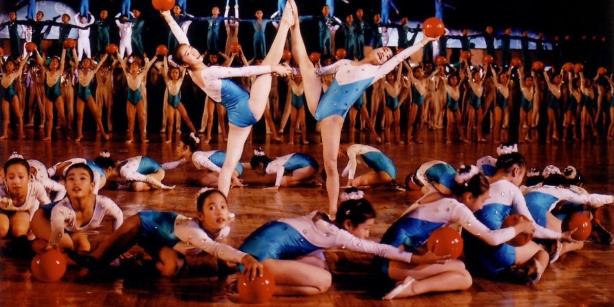 A group of gymnasts performing a routine in A State of Mind