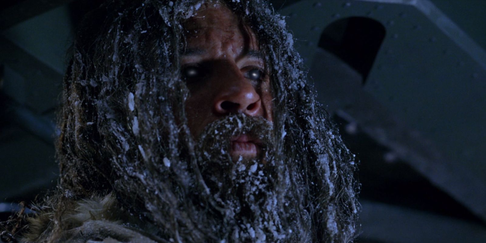 A bearded Riddick confronting Toombs in The Chronicles Of Riddick