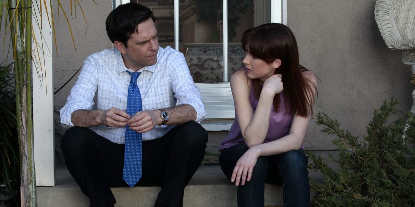 Andy and Erin sitting on a doorstep in The Office