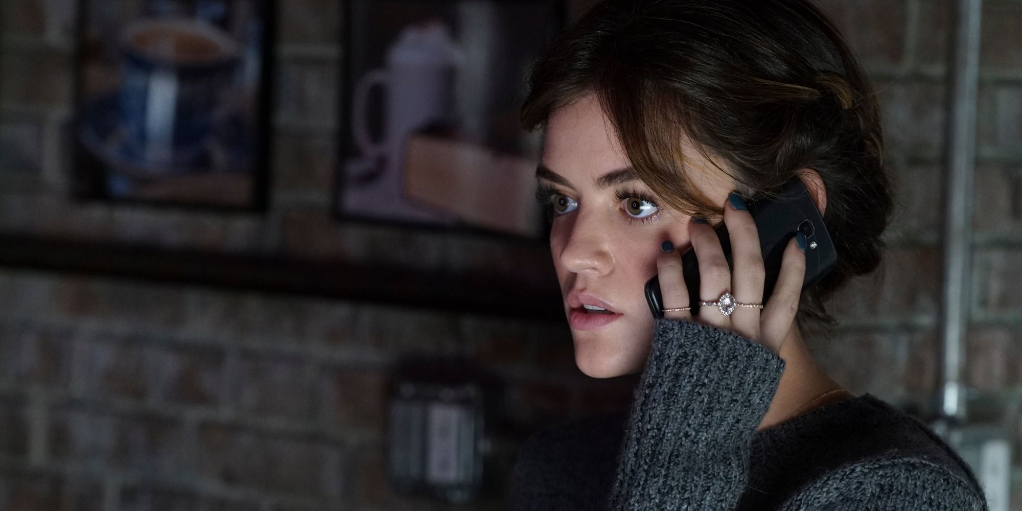 Lucy Hale as Aria talking on the phone on Pretty Little Liars