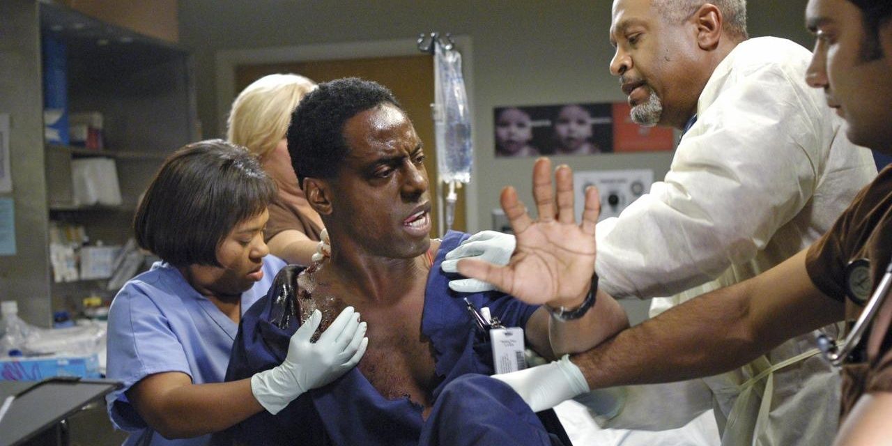 Bailey and Richard treat Burke's gunshot wound in Grey's Anatomy