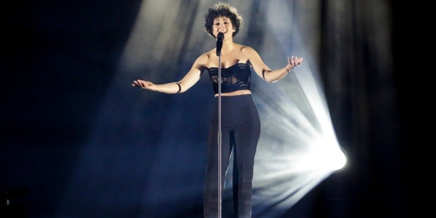 Barbara Pravi sings at Eurovision with a single spotlight