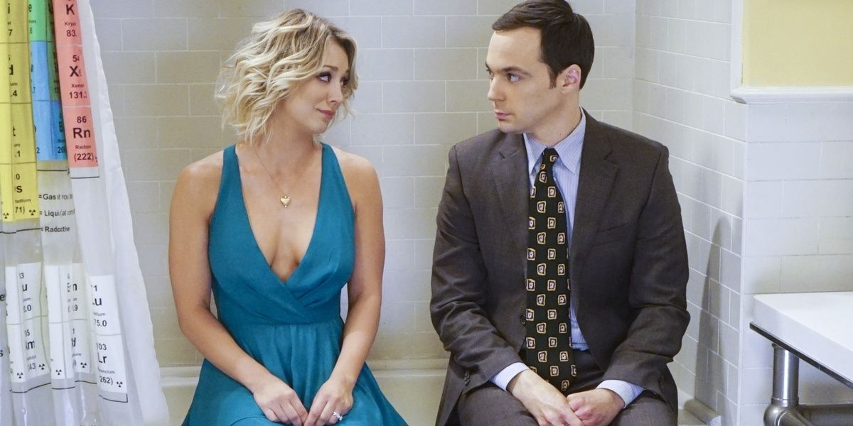 Penny and Sheldon sit on a bathtub wearing formal clothes in The Big Bang Theory