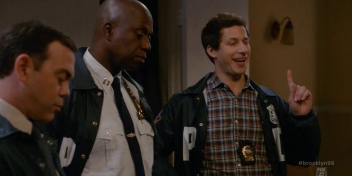 Jake, Charles, and Holt talking to a suspect on B99