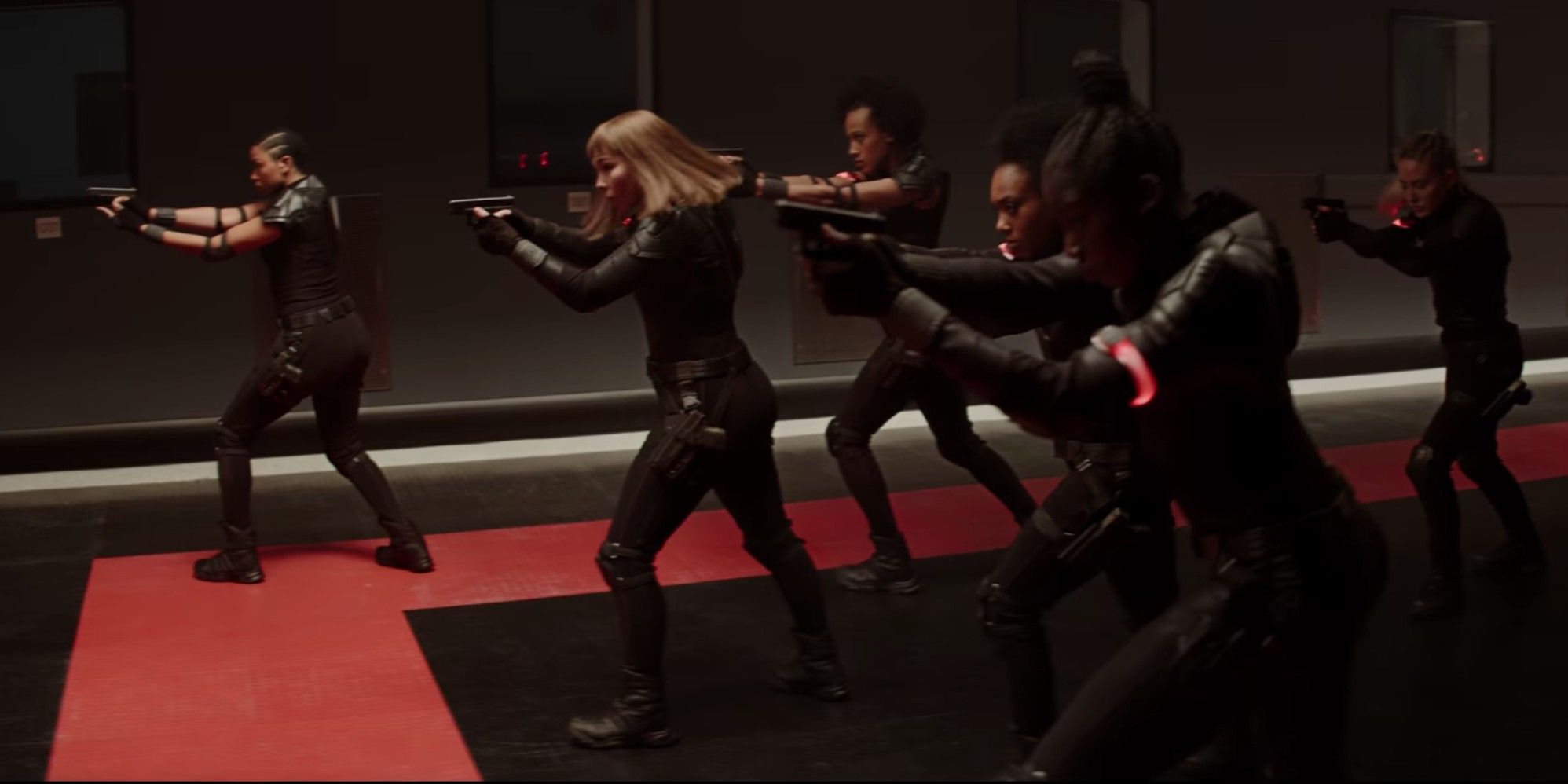A group of Black Widows training in the Red Room in Black Widow