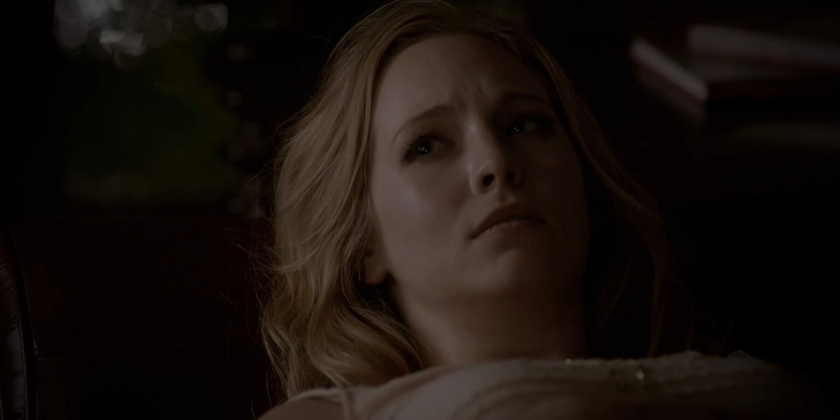 Caroline lays dying on the couch in The Vampire Diaries.