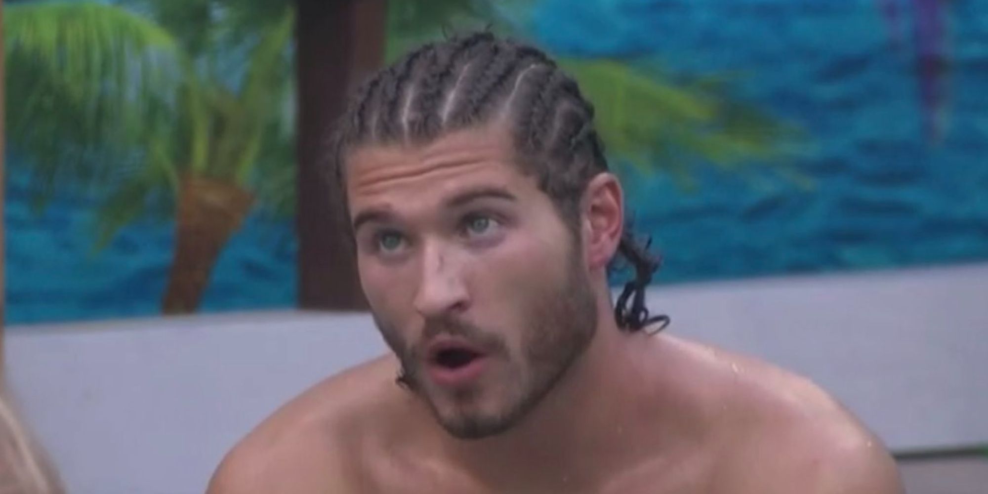 Christian from Big Brother 23 with corn rows, in mid-sentence.