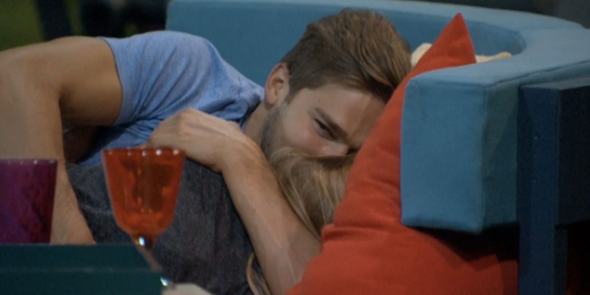 Clay kissing Shelli on Big Brother on the sofa.