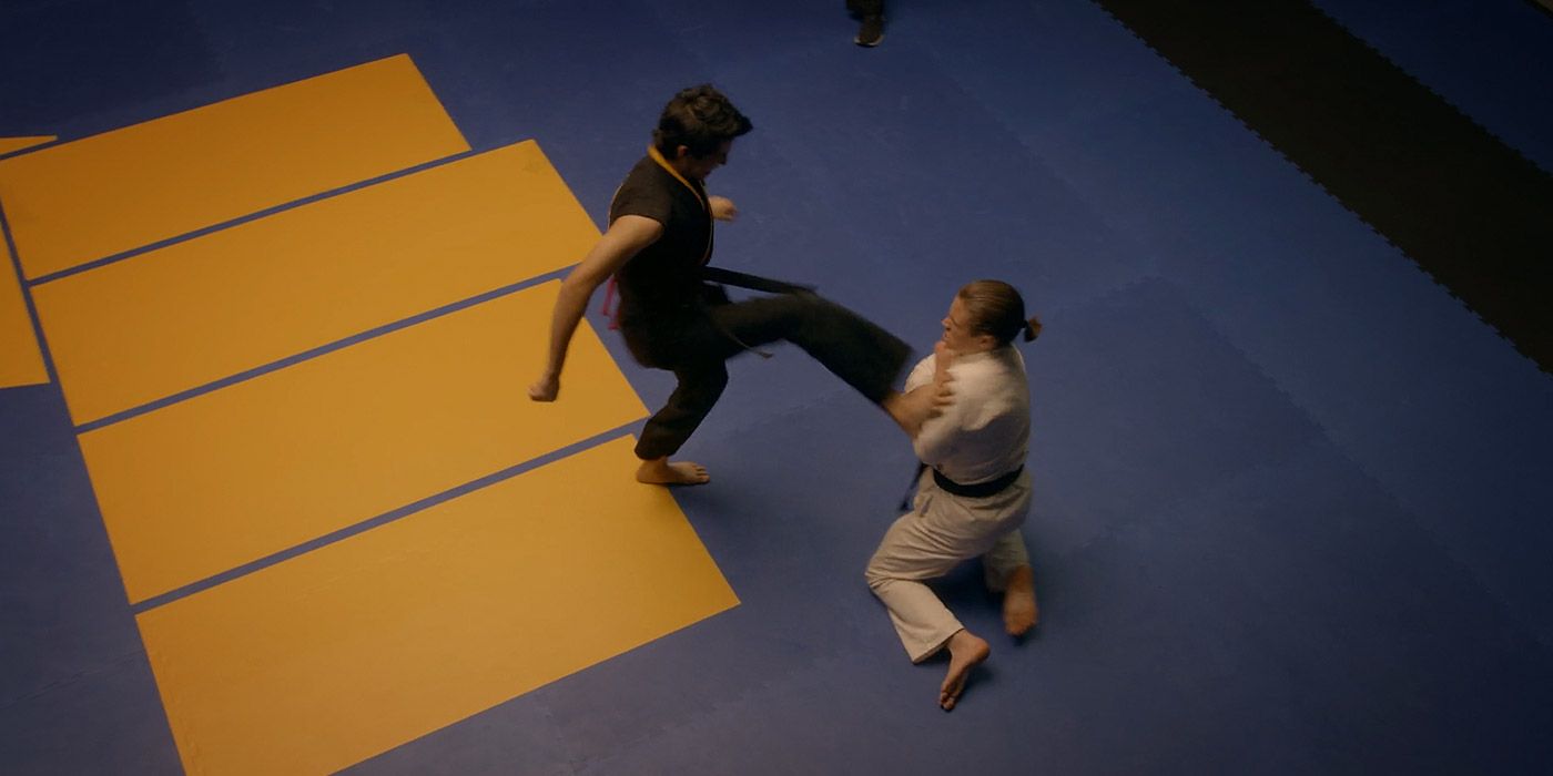 Miguel kicks Robby in his injured shoulder in Cobra Kai