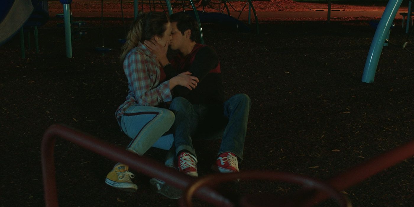 Miguel kisses Tory in a park in Cobra Kai