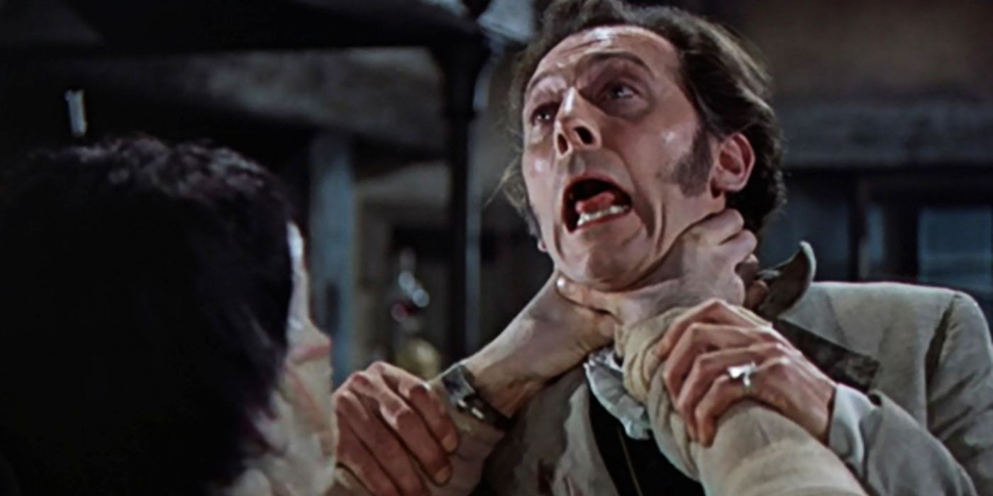 Peter Cushing is strangled by a monster in The Curse of Frankenstein.