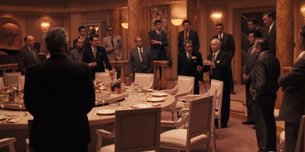 Michael, Joey Zasa, and their associates meet in a hotel in The Godfather Part III