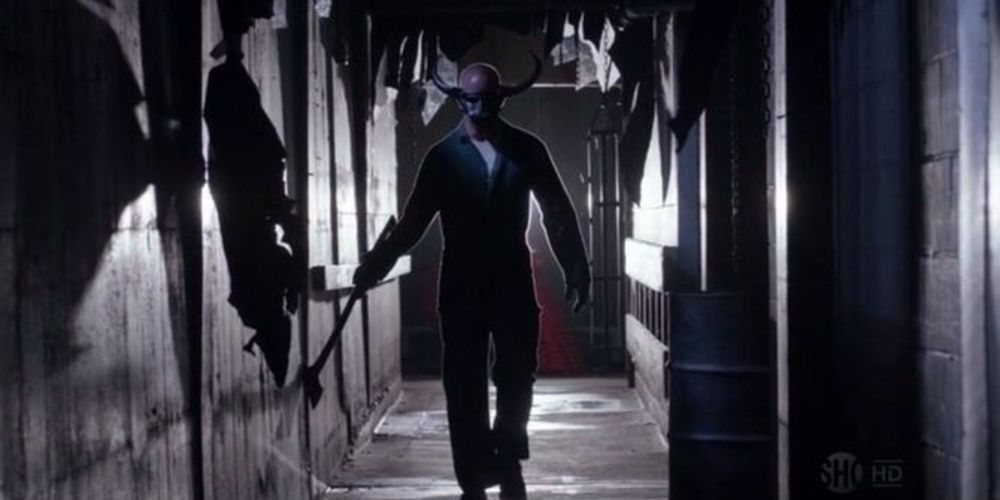Ray Speltzer wears a mask in a hallway