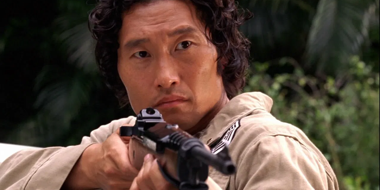 Jin points a gun in a Dharma Initiative outfit