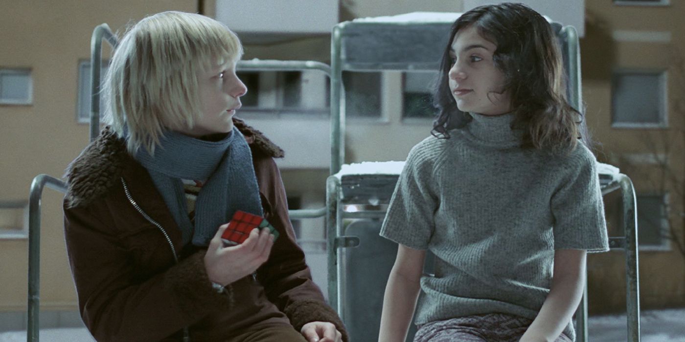 Eli and Oskar sit and talk in Let The Right One In