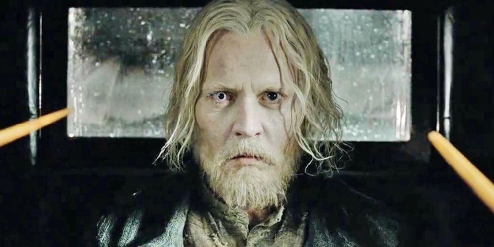 Grindelwald with long hair in prison in Fantastic Beasts 2