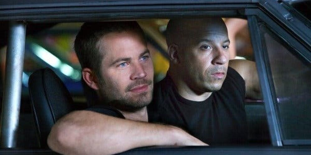 Dom and Brian look outside of their car in Fast Five