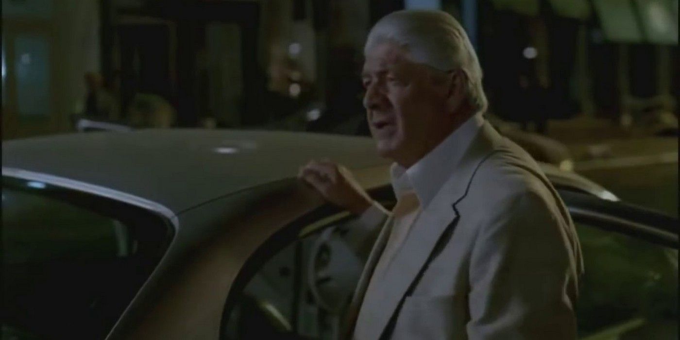 Faustino Doc Santoro standing by a car in The Sopranos