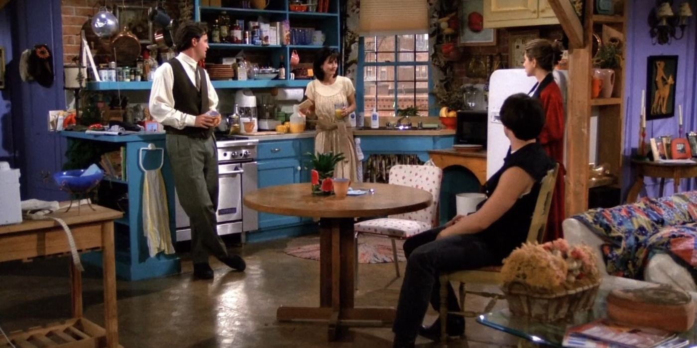 Monica Geller speaks to her friends Chandler, Joey and Rachel at her apartment in Friends