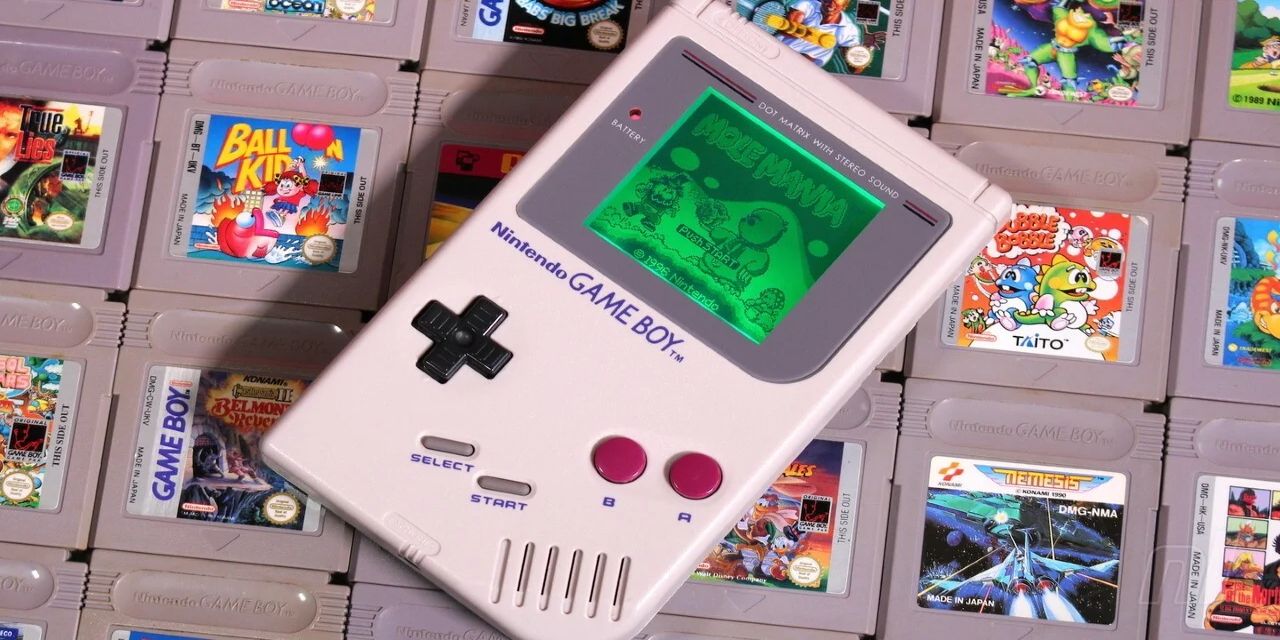 A modded GameBoy on a stack of games.