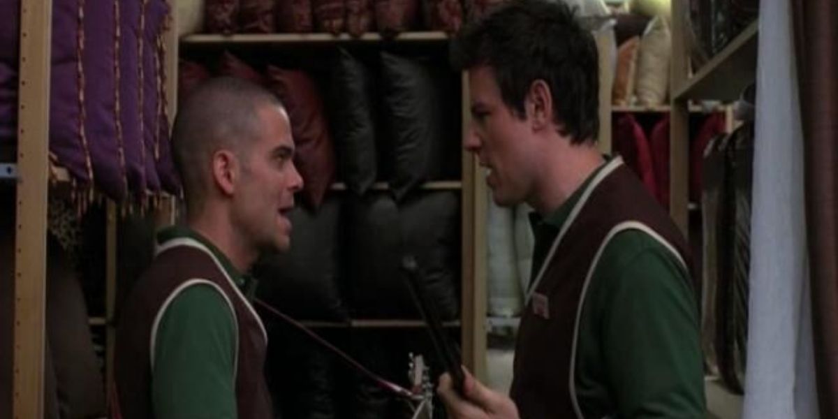 Puck and Finn look at each other while singing Loser