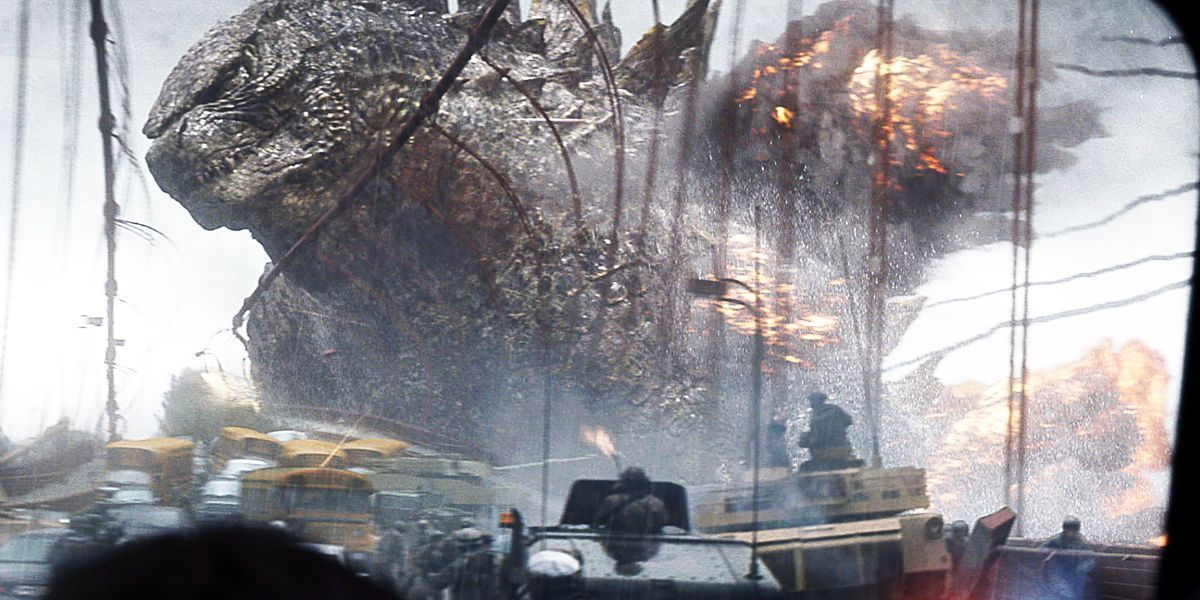 Godzilla attacks a bridge with military personnel.