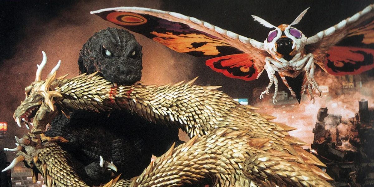 A fight scene from Godzilla, Mothra And King Ghidorah: Giant Monsters All-Out Attack, with Godzilla biting into Ghidorah.