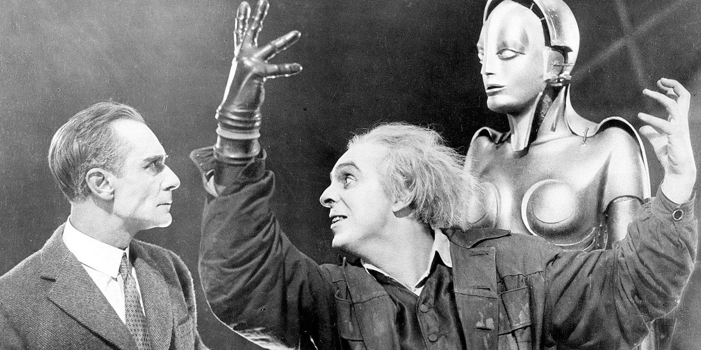 A shot of the android and two characters from Metropolis