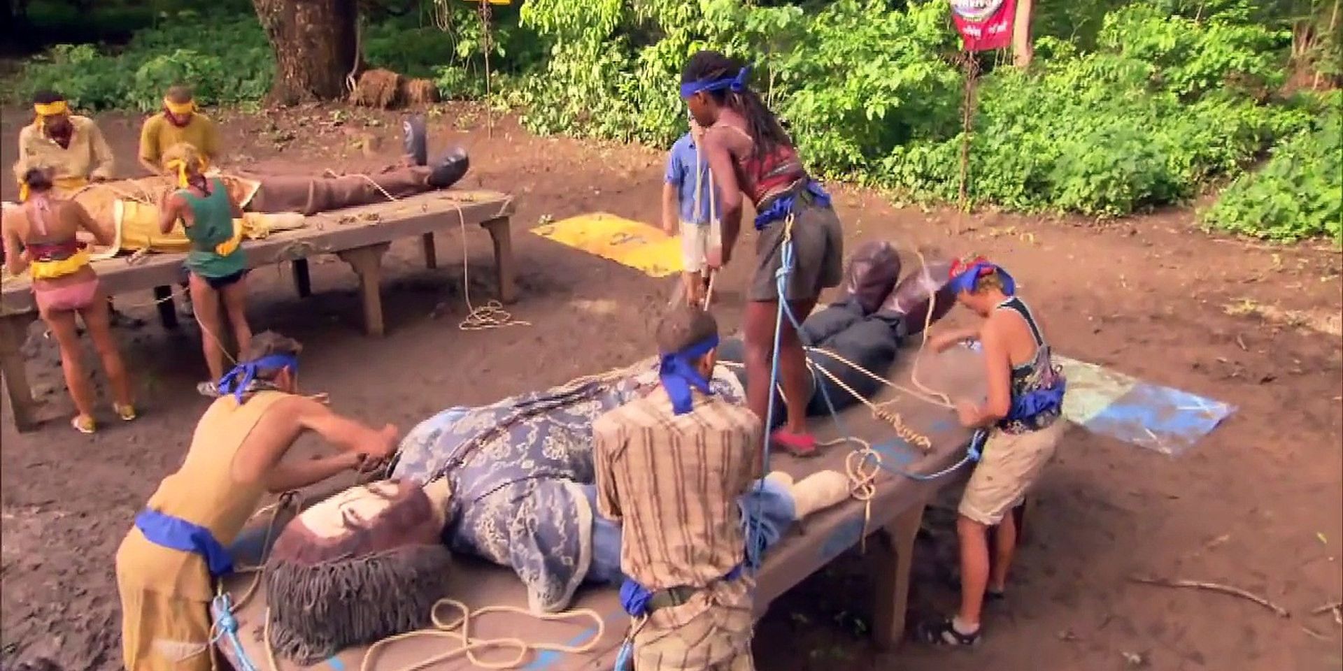 The cast of Survivor: Nicaragua building a large dummy in the Gulliver's Travels challenge