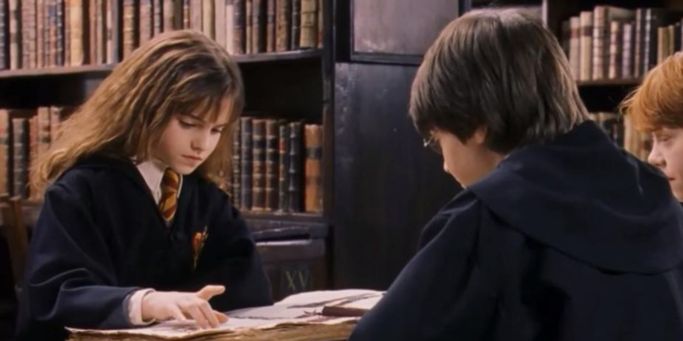 Hermione reading Hogwarts A History to Ron and Harry