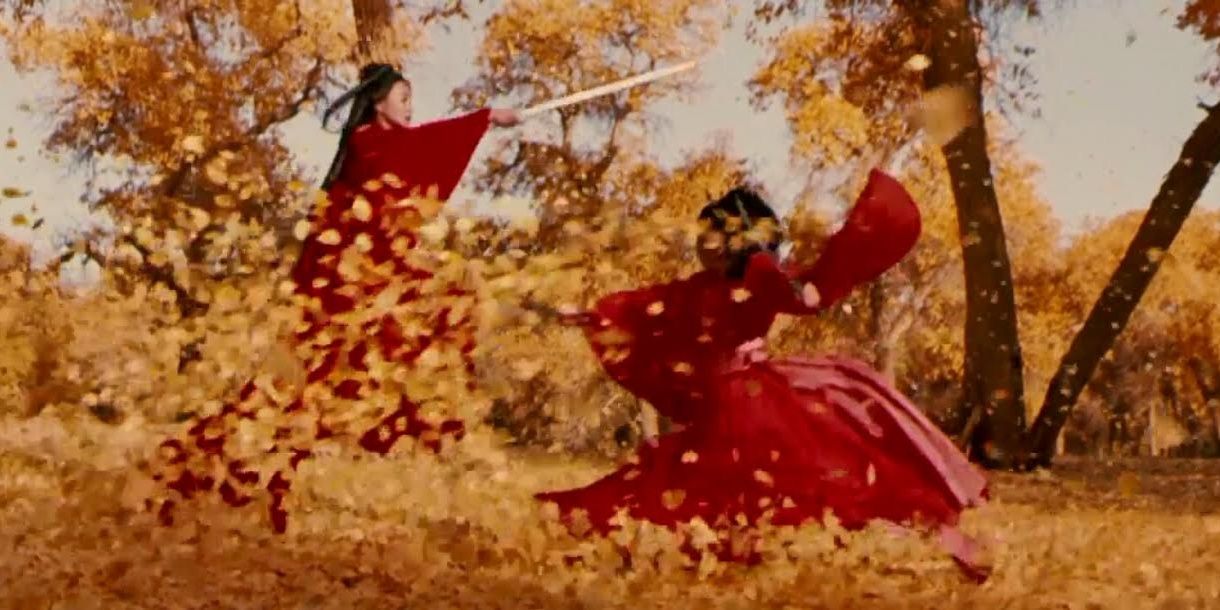 A fight scene from Hero with red robes and floating leaves