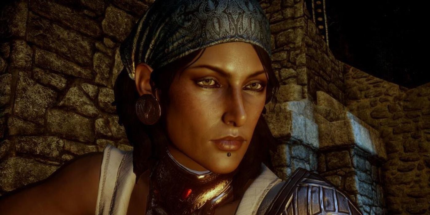 Isabela from Dragon Age 2 staring into a fire.