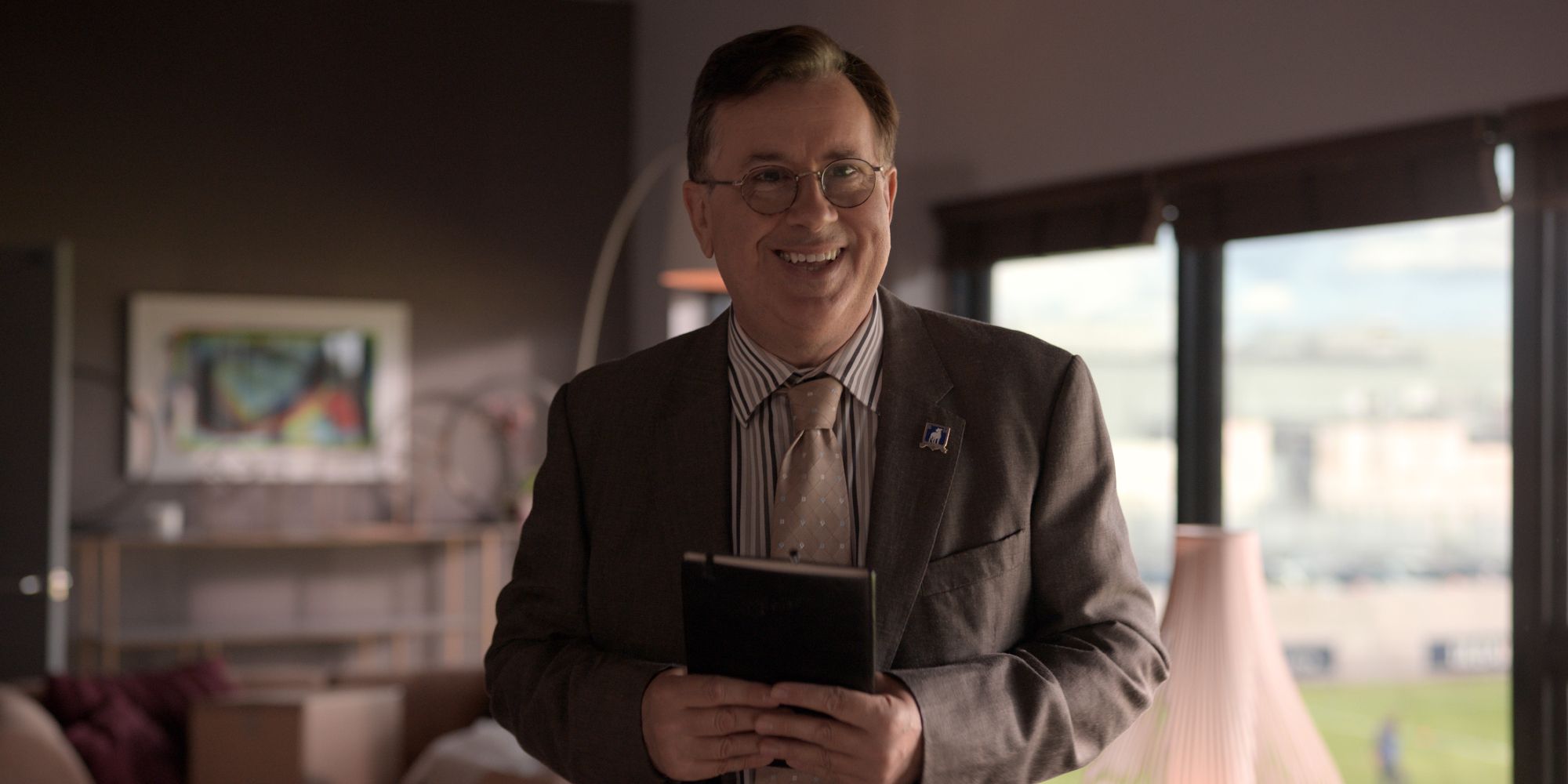 Higgins holds his journal in Rebecca's office in Ted Lasso.