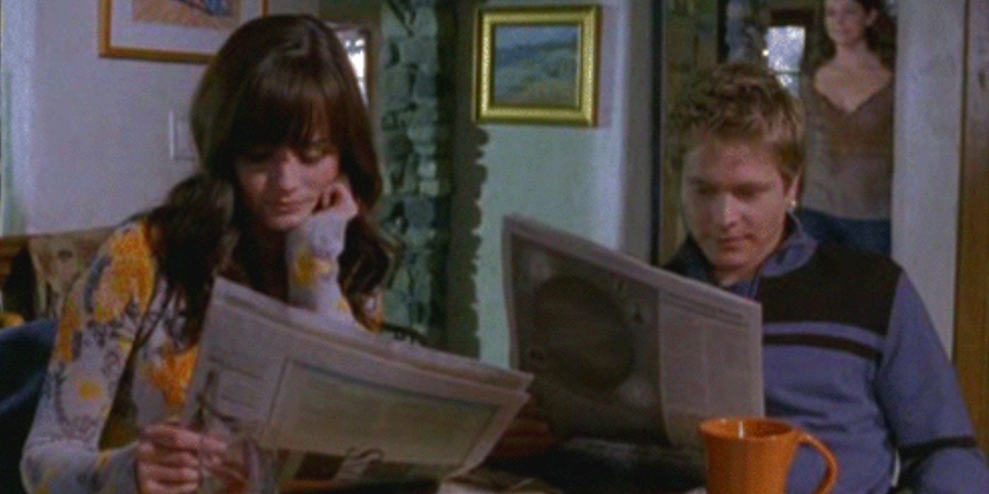 Jess and Rory reading the paper together on Gilmore Girls