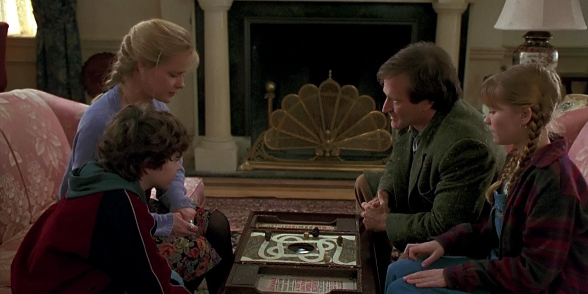 Everyone sits around the game board in Jumanji.
