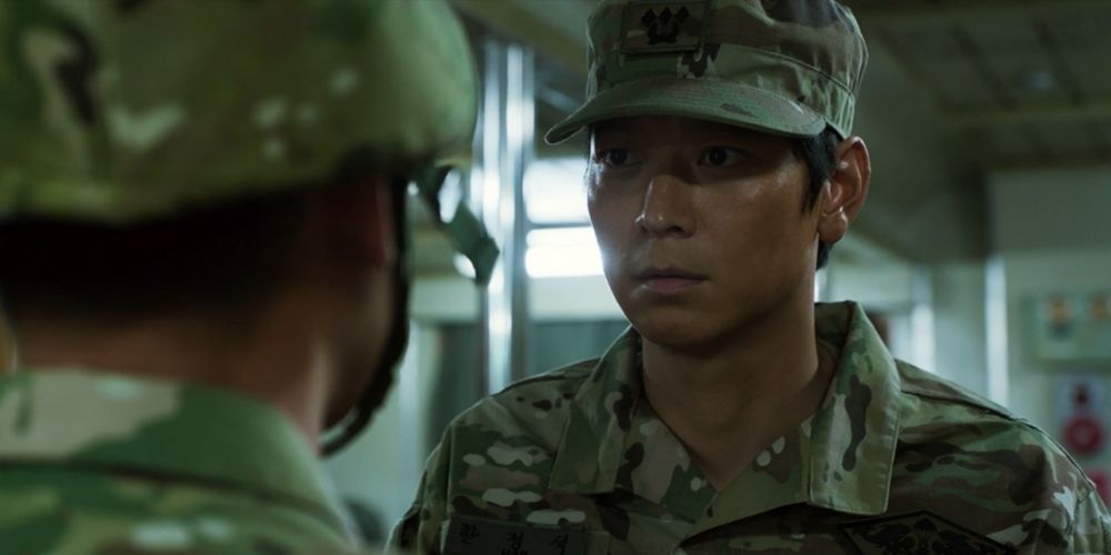 Jung-seok is a marine, wearing army clothes and talking to someone