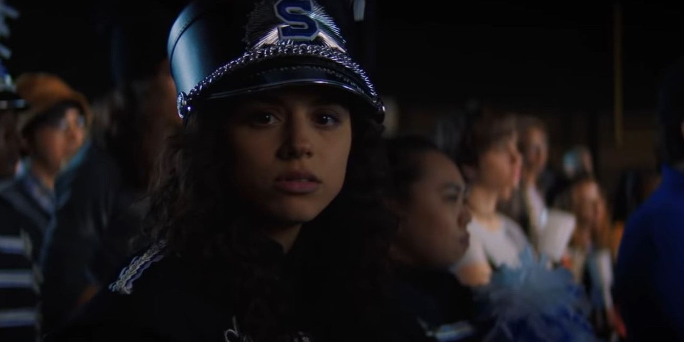 Kiana Madeira as Deena Johnson wearing a hat at the football game in Fear Street 1994