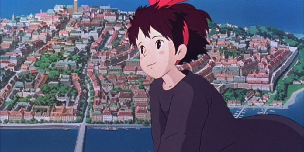 Kiki flying over the city in Kiki's Delivery Service