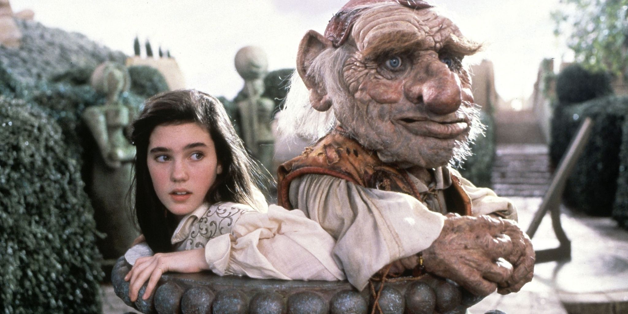 Jennifer Connelly and character of Hoggle side by side in Labyrinth