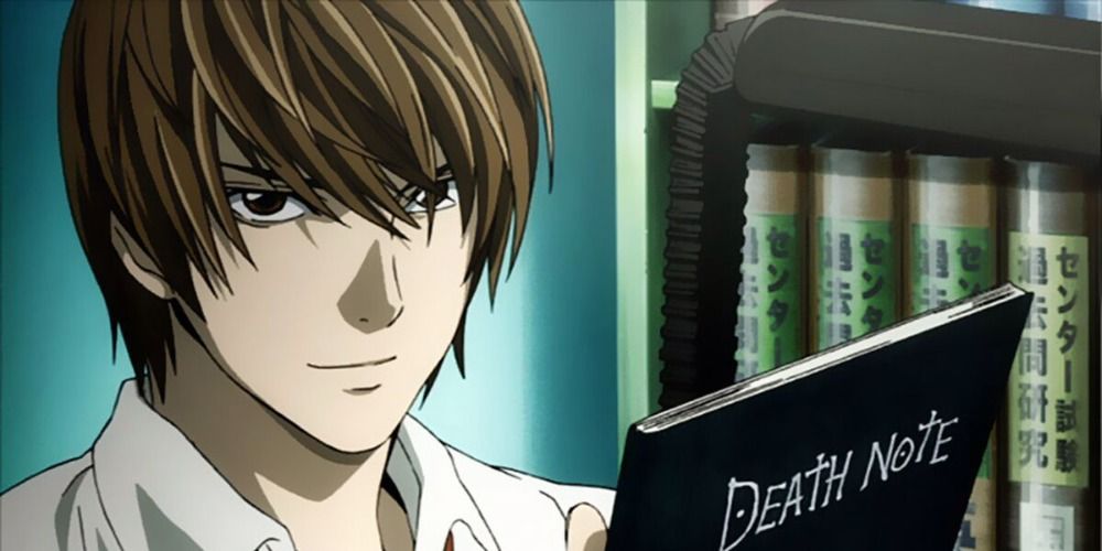 Light Yagami from Death Note holding the Death Note and smiling