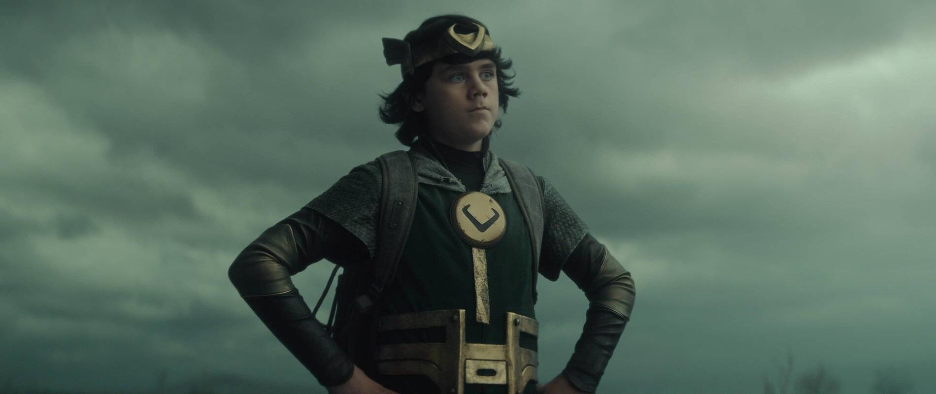 Kid Loki with his hands on his waist in Loki