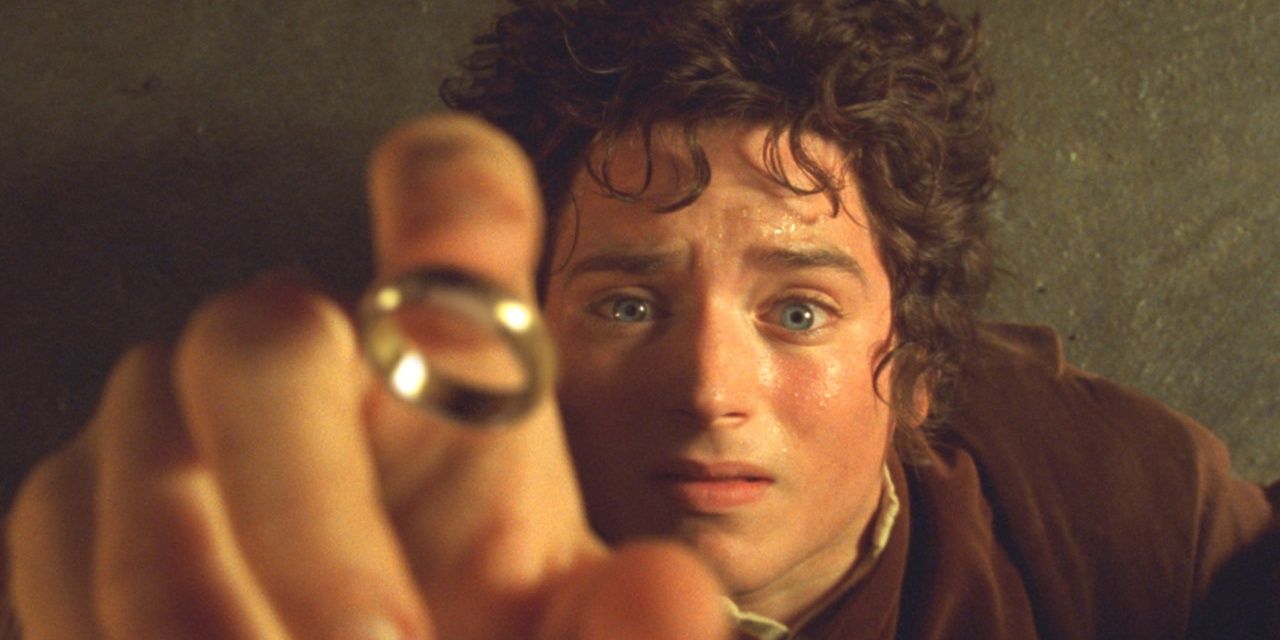 Frodo reaches for the ring in LOTR