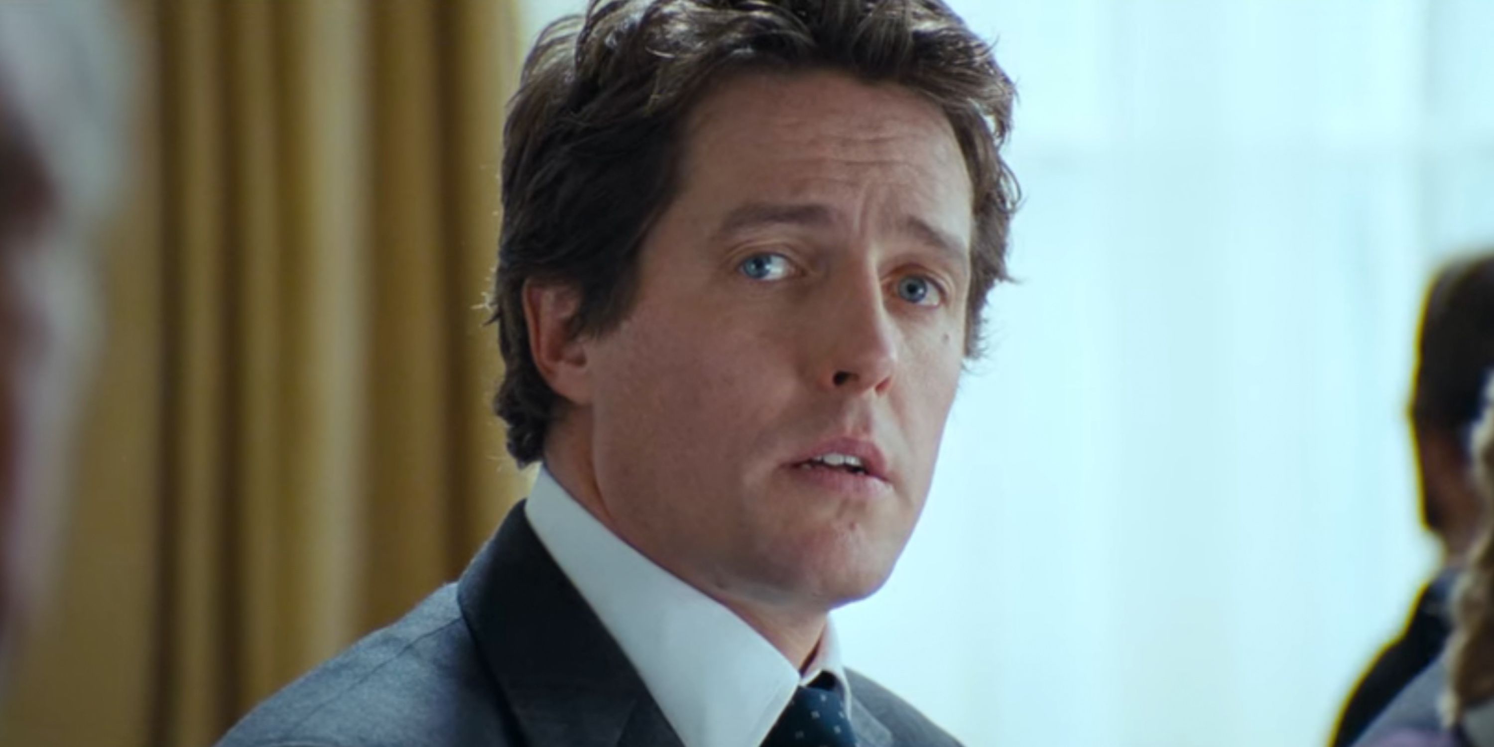 Hugh Grant as David looking concerned in Love Actually