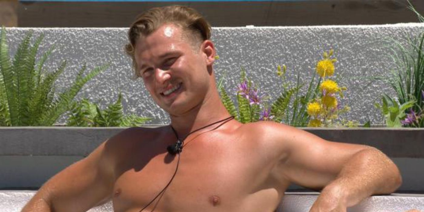 Chuggs Wallis smiling in the pool in Love Island UK